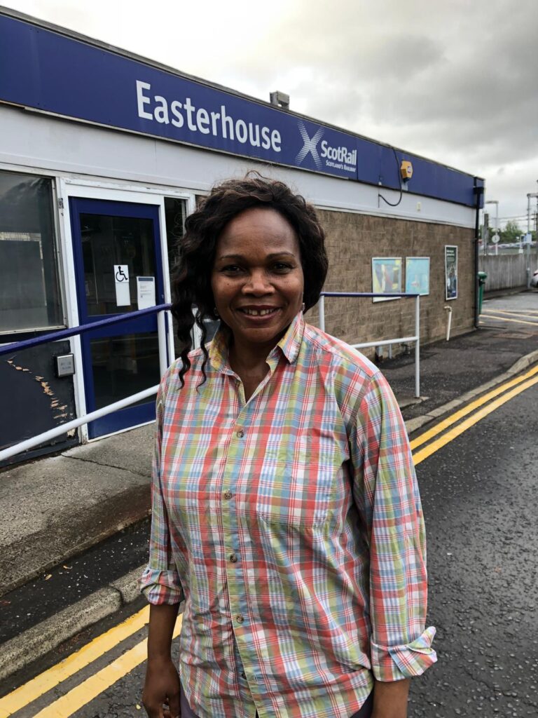 Josephine standing outside Easterhouse train station