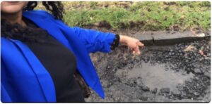 Josephine pointing out another dangerous pot-hole on a Scottish road